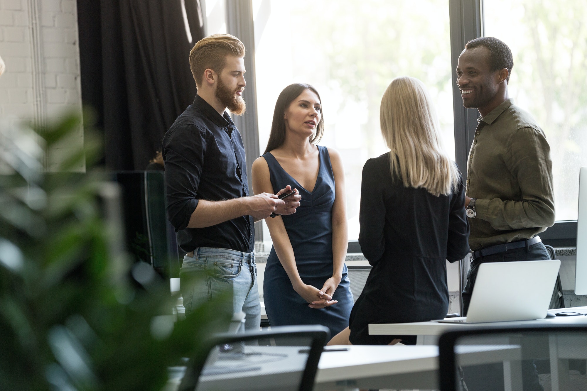 Creative agency coworkers discussing new project